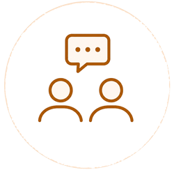 Icon of two people talking with a speech bubble.